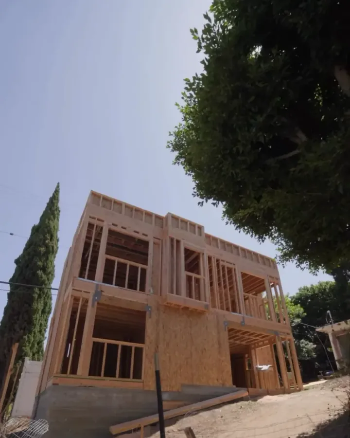 Two-story timber-framed ADU under construction on a Yeganeh Inc. job site